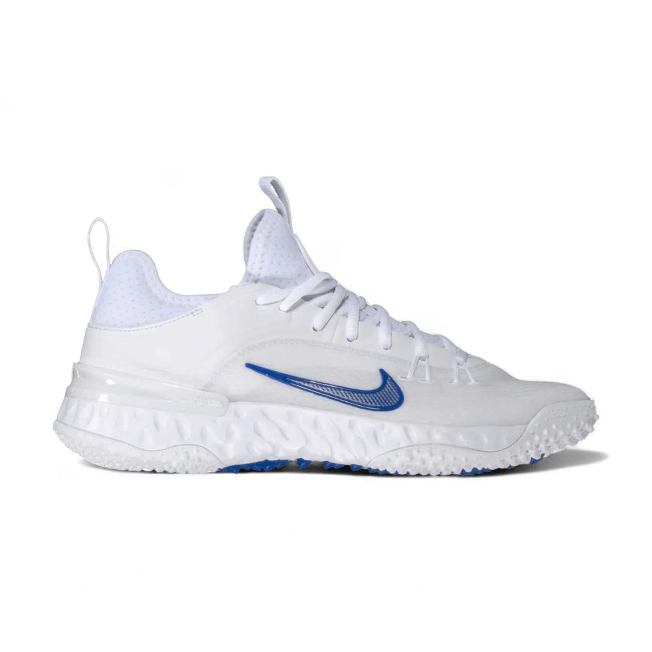 A white sneaker from Nike, known as the Alpha Huarache 9 Elite Turf Shoes - TB, showcases a striking blue swoosh logo. It draws inspiration from the iconic Nike Huarache 9 Lacrosse Cleats, featuring a textured sole and classic lace-up design with a convenient pull tab on the heel. Set against a black backdrop, its multidirectional traction details stand out prominently.